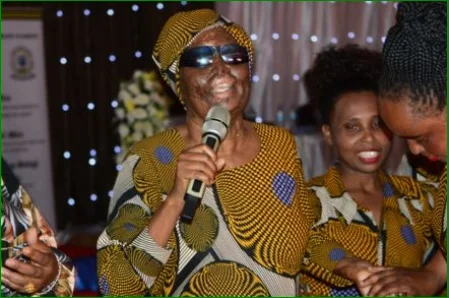 A visually impaired woman singing the song "International Women's Day" in 2024 in Karatu District Center.